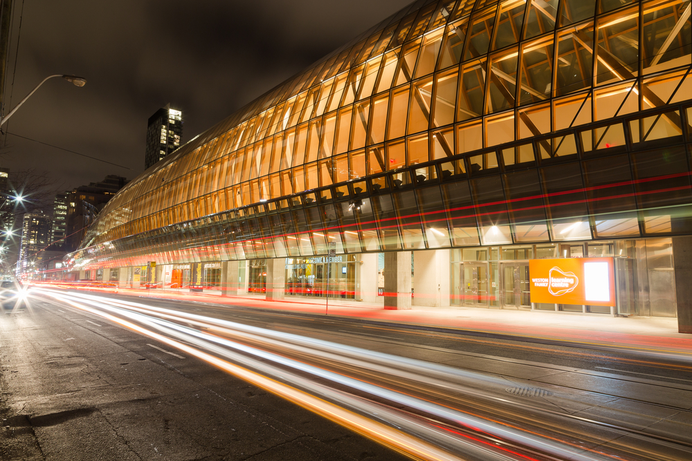 The Outside Of The Art Gallery Of Ontario With Traffic Going Past